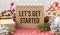 A text sign that says Let`s Get Started .