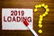 Text sign showing 2019 Loading. Conceptual photo Advertising the upcoming year Forecasting the future event White paper marker cru