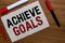 Text sign showing Achieve Goals. Conceptual photo Results oriented Reach Target Effective Planning Succeed White paper red borders