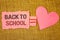 Text sign showing Back To School. Conceptual photo Return to class first day of studies Classroom Arriving Text pink torn note equ