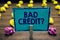 Text sign showing Bad Credit question. Conceptual photo history when it indicates that borrower has high risk Clothespin holding b