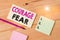 Text sign showing Courage Fear. Conceptual photo quality of mind that enables a demonstrating to face difficulty Colored