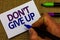 Text sign showing Don t not Give Up. Conceptual photo Determined Persevering Continue to Believe in Yourself Man hand holding mark