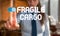 Text sign showing Fragile Cargo. Conceptual photo Breakable Handle with Care Bubble Wrap Glass Hazardous Goods Blurred