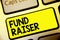 Text sign showing Fund Raiser. Conceptual photo person whose job or task is seek financial support for charity Keyboard yellow key