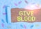 Text sign showing Give Blood. Conceptual photo demonstrating voluntarily has blood drawn and used for transfusions Paper