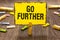 Text sign showing Go Further. Conceptual photo To move to a greater distance or overcome your limitations Clothespin holding yello