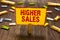 Text sign showing Higher Sales. Conceptual photo The average sold products and services of a company has grown Clothespin holding