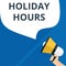 Text sign showing Holiday Hours