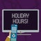 Text sign showing Holiday Hours. Conceptual photo Overtime work on for employees under flexible work schedules Hand