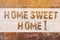 Text sign showing Home Sweet Home. Conceptual photo In house finally Comfortable feeling Relaxed Family time Brick Wall