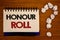 Text sign showing Honour Roll. Conceptual photos List of students who have earned grades above a specific averageIdeas on notebook