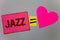 Text sign showing Jazz. Conceptual photo Type of music of black American origin Musical genre Strong rhythm Paper Heart equal sign