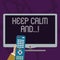 Text sign showing Keep Calm And. Conceptual photo motivational poster produced by British government Hand Holding