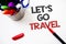 Text sign showing Let \'S Go Travel. Conceptual photo Going away Travelling Asking someone to go outside Trip Pen white background