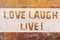 Text sign showing Love Laugh Live. Conceptual photo Be inspired positive enjoy your days laughing good humor Brick Wall