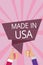 Text sign showing Made In Usa. Conceptual photo American brand United States Manufactured Local product Man woman hands thumbs up