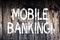 Text sign showing Mobile Banking. Conceptual photo Online Money Payments and Transactions Virtual Bank Wooden background