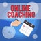 Text sign showing Online Coaching. Conceptual photo Learning from online and internet with the help of a coach Male Hand