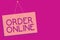 Text sign showing Order Online. Conceptual photo Buying goods and services from the sellers over the internet Pink board wall mess