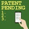 Text sign showing Patent Pending. Word Written on Request already filed but not yet granted Pursuing protection