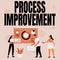 Text sign showing Process Improvement. Business idea Optimization Meet New Quotas Standard of Quality Employee Helping