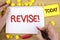 Text sign showing Revise Motivational Call. Conceptual photo Reconsider something to improve it Review written by Man on Notepad h