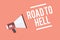 Text sign showing Road To Hell. Conceptual photo Extremely dangerous passageway Dark Risky Unsafe travel Megaphone loudspeaker pin