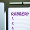 Text sign showing Robbery. Word Written on the action of taking property unlawfully from a person or place by force or