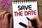 Text sign showing Save The Date. Conceptual photo Remember not to schedule anything else that time Appointment written by Man Hold