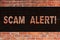 Text sign showing Scam Alert. Conceptual photo Safety warning to avoid fraud or virus attacks Brick Wall art like