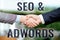 Text sign showing Seo And Adwords. Word Written on they are main tools components of Search Engine Marketing Two