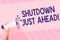Text sign showing Shutdown Just Ahead. Conceptual photo closing factory business either short time or forever Human Hand