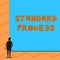 Text sign showing Standard Process. Conceptual photo rules made to be matched with final product quality Man stands in