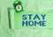 Text sign showing Stay Home. Conceptual photo not go out for an activity and stay inside the house or home Rolled ripped