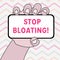 Text sign showing Stop Bloating. Conceptual photo to end the condition where your belly feels full and tight Closeup of