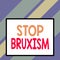 Text sign showing Stop Bruxism. Conceptual photo put an end to a condition which you grind or clench the teeth Front close up view