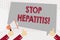 Text sign showing Stop Hepatitis. Conceptual photo Treatment or prevention of the inflammation of the liver Hand Holding