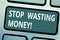 Text sign showing Stop Wasting Money. Conceptual photo avoid dissipation waste useless or profitless activity Keyboard