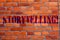 Text sign showing Storytelling. Conceptual photo Tell short Stories Personal Experiences Brick Wall art like Graffiti