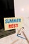 Text sign showing Summer Rest. Conceptual photo taking holiday break or unwind from work or school during summer Note paper taped