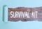 Text sign showing Survival Kit. Conceptual photo Emergency Equipment Collection of items to help someone.