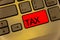 Text sign showing Tax. Conceptual photo Compulsory payment of taxes by people to government increase revenue Keyboard brown key ye