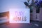 Text sign showing Tiny Homes. Conceptual photo houses contain one room only or two and small entrance Cheap Flowers and
