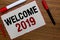 Text sign showing Welcome 2019. Conceptual photo New Year Celebration Motivation to Start Cheers Congratulations White paper red b