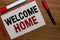 Text sign showing Welcome Home. Conceptual photo Expression Greetings New Owners Domicile Doormat Entry White paper red borders ma