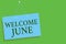 Text sign showing Welcome June. Conceptual photo Calendar Sixth Month Second Quarter Thirty days Greetings Blue board wall message