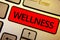 Text sign showing Wellness. Conceptual photo Making healthy choices complete mental physical relaxation Keyboard brown keys yellow