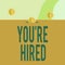Text sign showing You Re Hired. Conceptual photo New Job Employed Newbie Enlisted Accepted Recruited Three gold