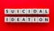 Text Suicidal Ideation on wooden cubes. Suicidal thoughts. Prevention. Mental health, mind problem, disorder and depression.